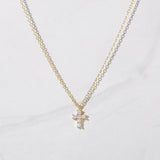Tiny Cross Necklace: Gold